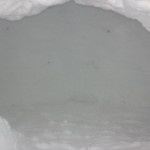 How to build a quinzhee snow structure: digging out the snow from the inside